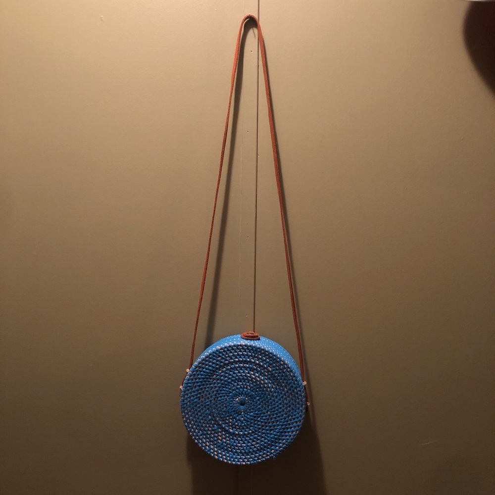 Jelavu Ata Bali Round Rattan Crossbody Bag in a vibrant blue shade
